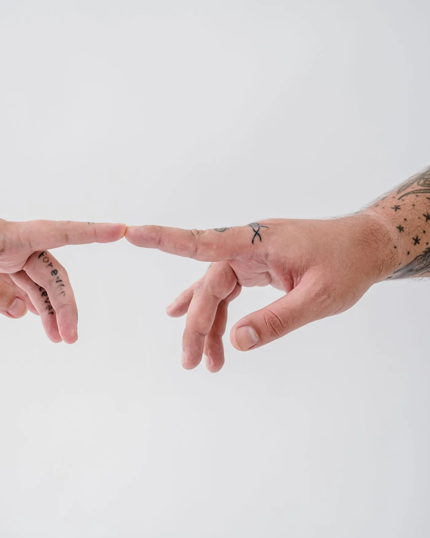 Very small fine-line marks on the fingers, photographed against a plain background.