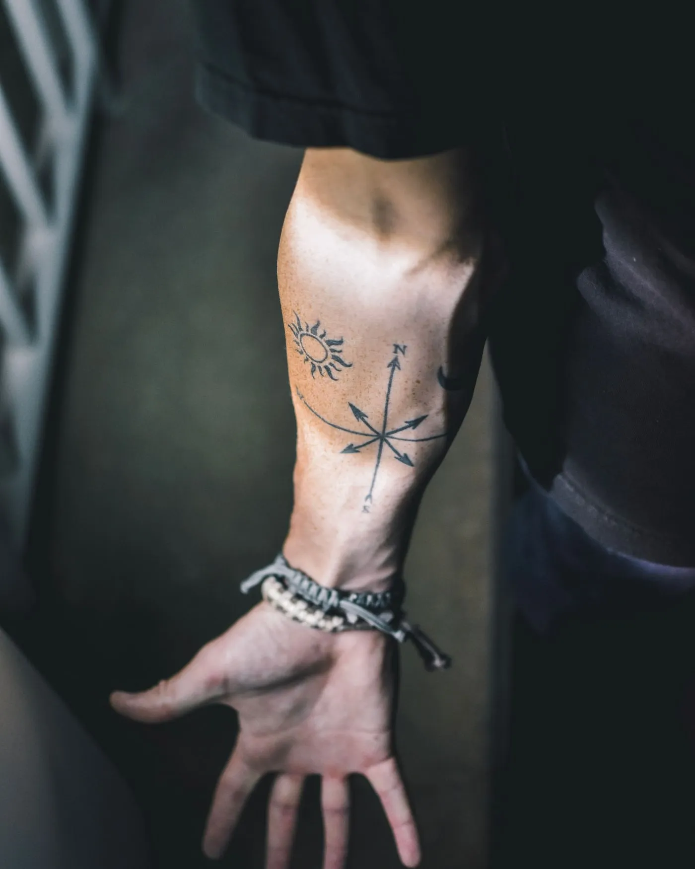 A fine botanical sprig tattooed on the inner wrist, photographed the day it was done.